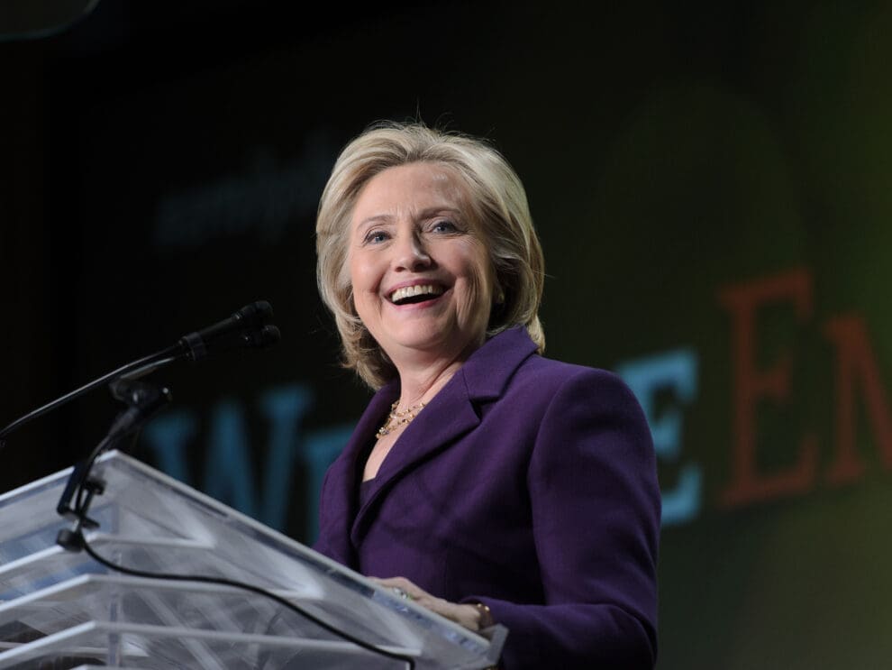 Image of Hillary Clinton, speaking at a podium.